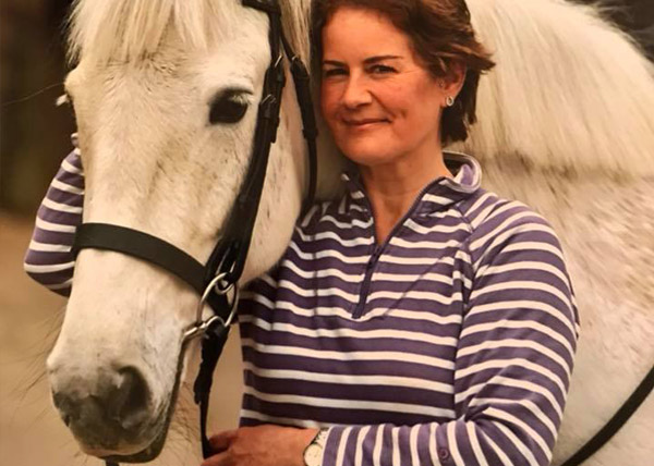 owner with white horse