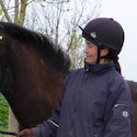 owner looking affectionately at her horse